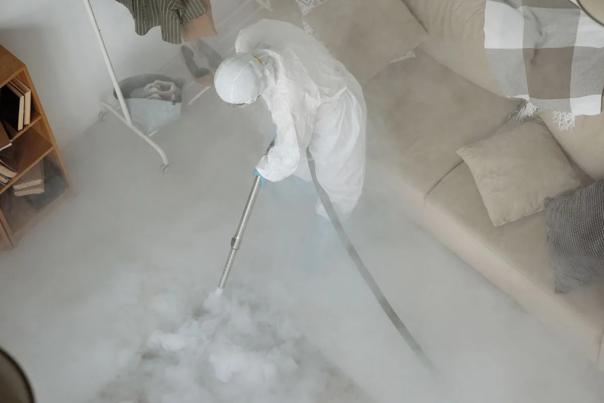 Biohazard cleanup technician in protective equipment, Blair, WI